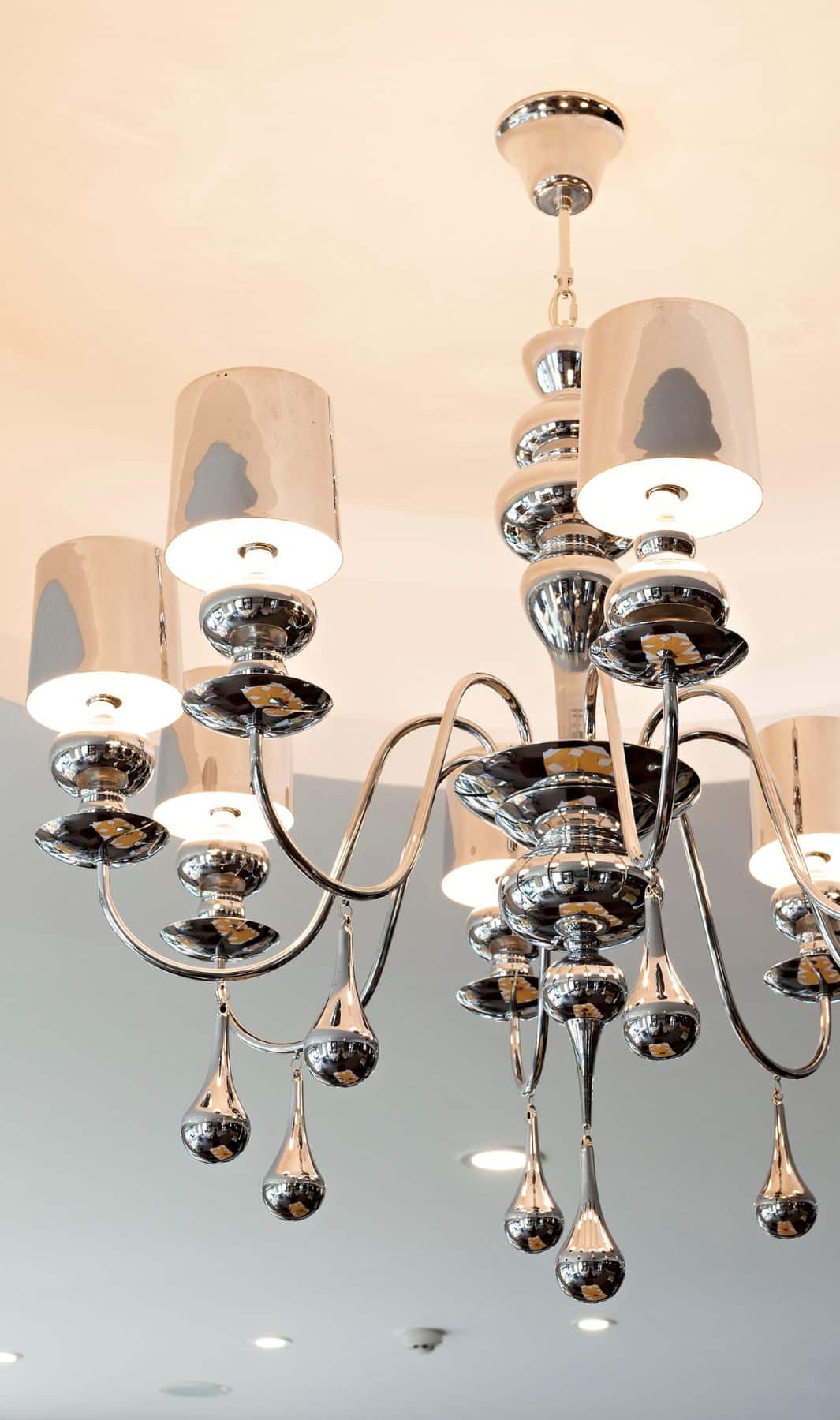 A modern chrome chandelier polished streak-free by Bailey Boys Services