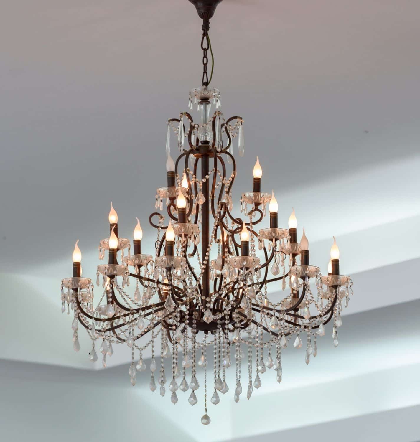 A large ornate wrought-iron crystal chandelier cleaned and restored in a Sacramento-area home
